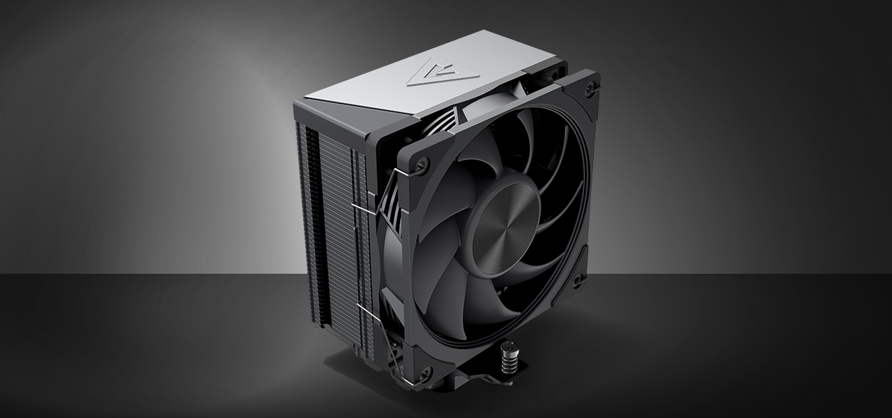 Zdjęcie chłodzenia MODECOM Volcano 0C na ciemnym tle, widok pod kątem z góry z widocznym od frontu wentylatorem i aluminiowym topem